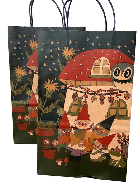 Two paper bags with fairy tale design featuring gnomes, mushrooms, and an owl.