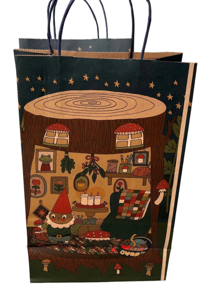 Decorative paper bag with a gnome design featuring a tree stump and wood-themed elements.