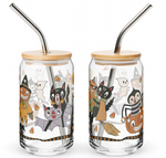 Two glass tumblers with Halloween-themed character designs, including a witch and pumpkins, accompanied by metal straws. The tumblers have bamboo lids.