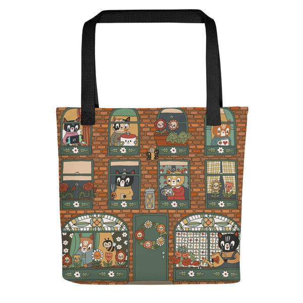 Tote bag with cartoon cat designs on a brick wall pattern