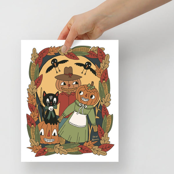 vintage style pumpkin scarecrows in a corn field with black cat