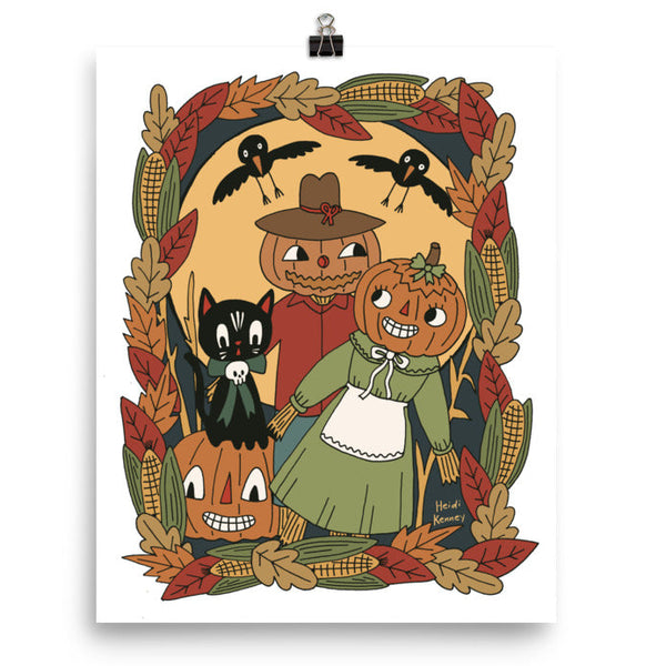 vintage style pumpkin scarecrows in a corn field with black cat