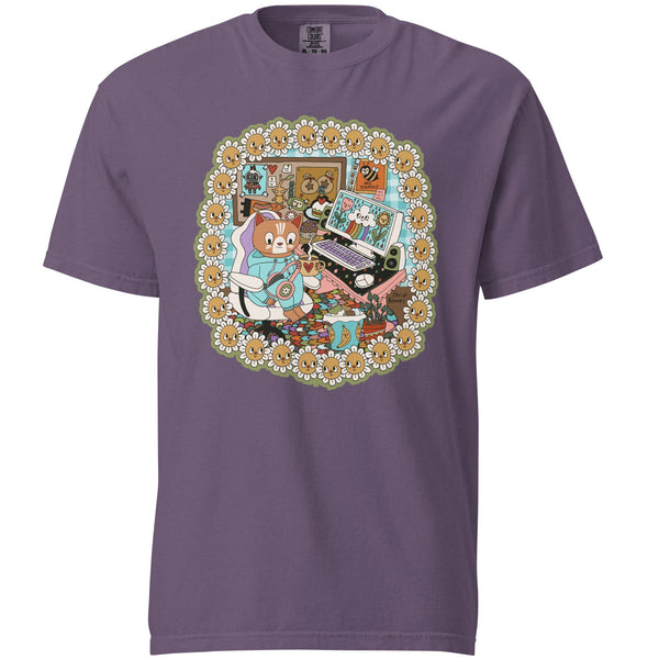 Purple t-shirt with a colorful graphic of a cartoon cat playing computer games and flowers on a white background