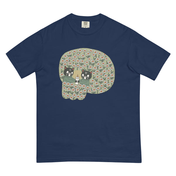 navy blue t-shirt with a design that resembles a skull but is two illustrated cats holding a candle in a field of flowers 