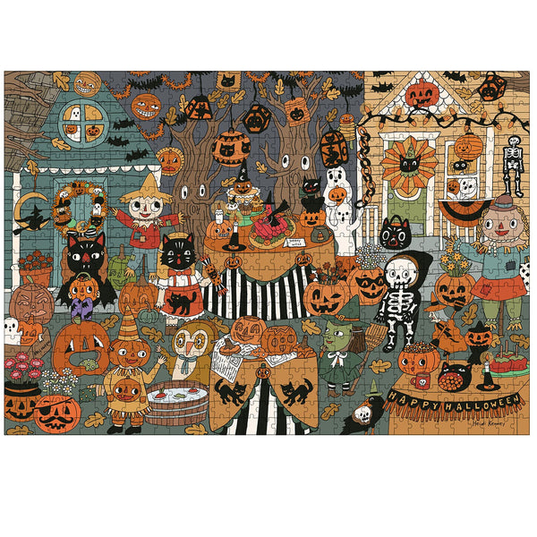 A completed jigsaw puzzle featuring a dense, whimsical Halloween scene with pumpkins, cats, ghosts, a skeleton, a witch, and houses decorated for the holiday, shown against a plain white background.
