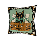 A Halloween themed pillow featuring a cat, pumpkins and ghosts.